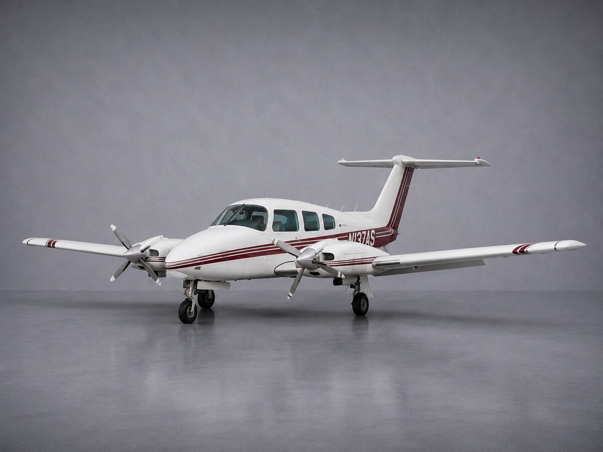 Beechcraft BE-76 Duchess N137AS twin-engine trainer with counter-rotating propellers on the ramp at Fort Lauderdale Executive Airport (KFXE)